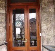 Custom entry door on commercial building in Historic district of Philadelphia. Door were made to match adjacent door, but modified to comply with ADA standards.